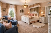 Unwind in The Beland’s Blushing Rose Suite—King Comfort in Grand Colonial Style
